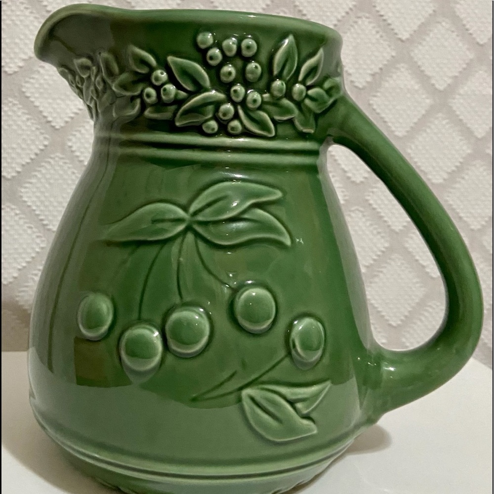 Ceramic pitcher with embossed cherries and leaves